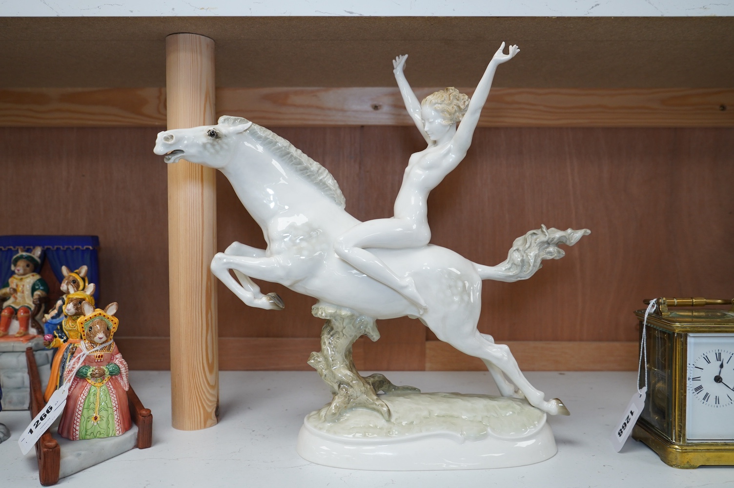 An Art Deco Hutschenreuther female nude rider on horseback, 32cm high. Condition - thumb of rider cracked